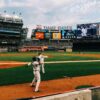 baseball players playing on field during daytime