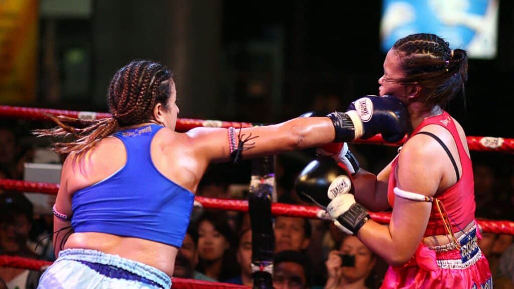 woman in blue sports bra and white shorts