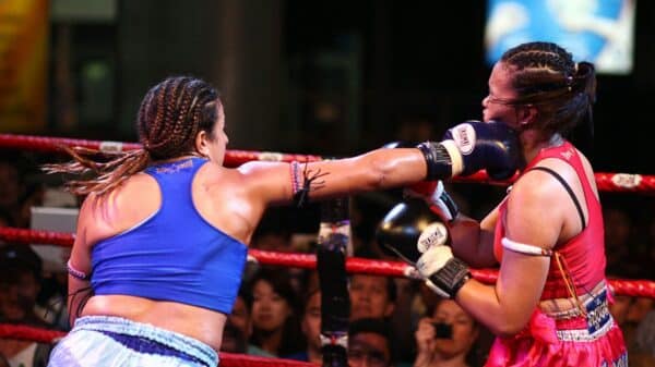 woman in blue sports bra and white shorts