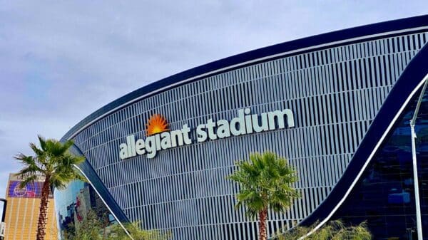 a large building with palm trees in front of it