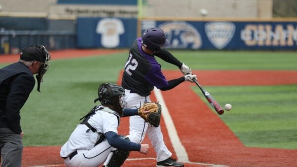 baseball player swinging bat