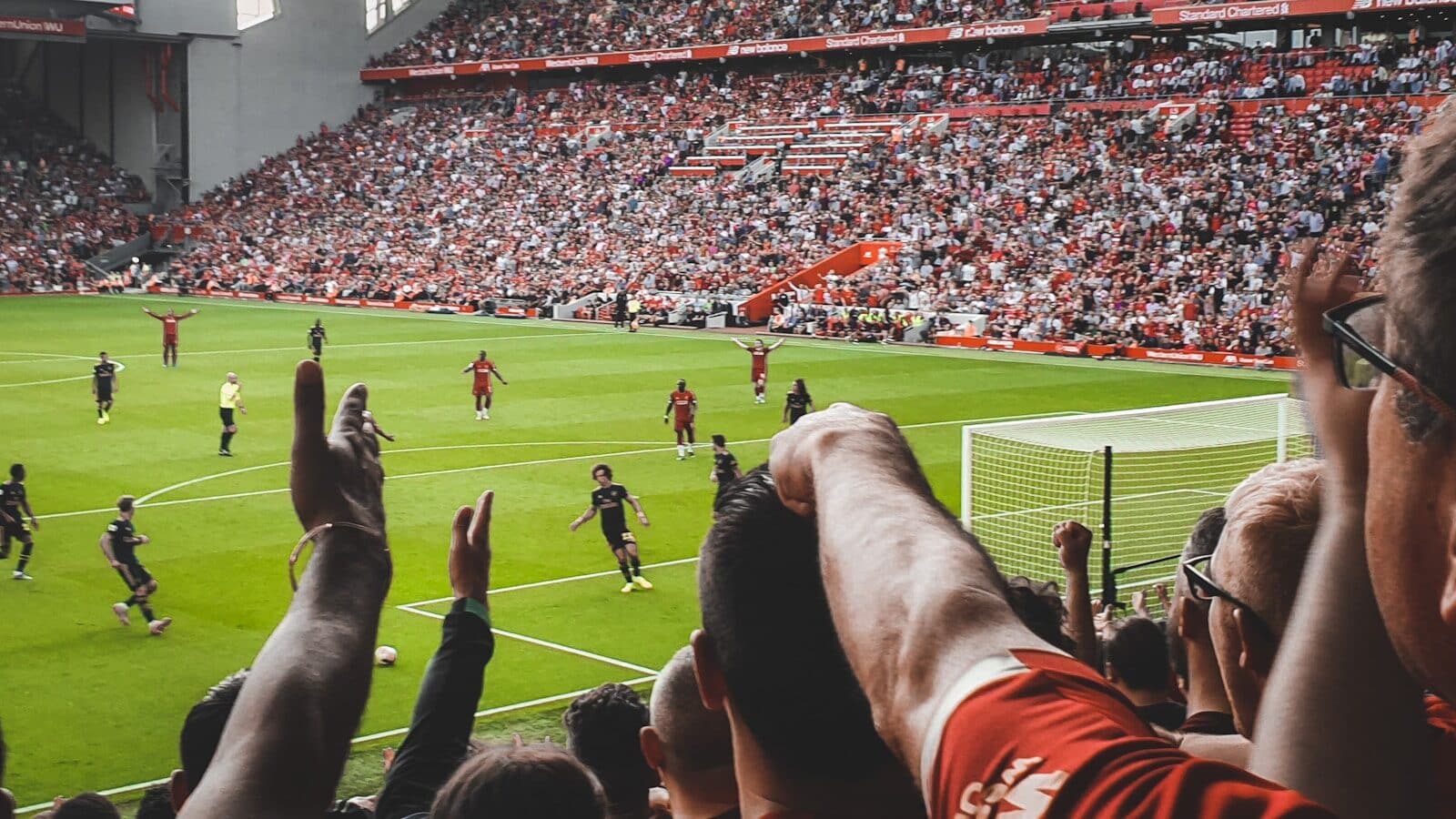 a crowd of people watching a soccer game