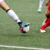 a couple of men playing a game of soccer